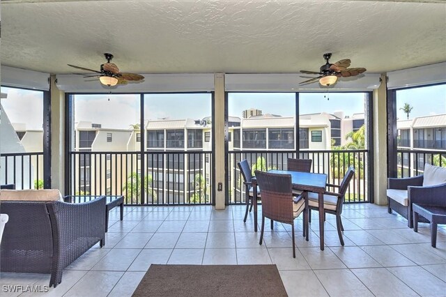 929 Collier Ct Unit B401, Marco Island, FL 34145 - sunroom with a ceiling fan and outdoor dining area