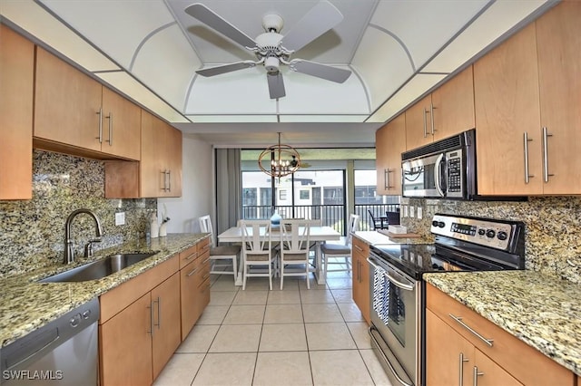 929 Collier Ct Unit B401, Marco Island, FL 34145 - kitchen featuring stainless steel appliances, a sink, light tile patterned flooring, a ceiling fan, and backsplash