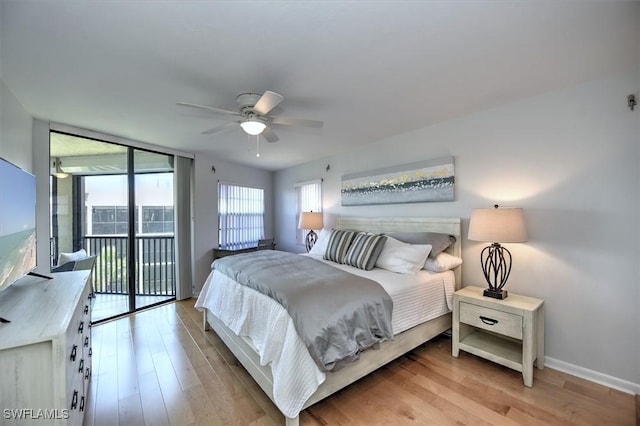 929 Collier Ct Unit B401, Marco Island, FL 34145 - bedroom featuring access to exterior, light wood-style flooring, baseboards, and ceiling fan
