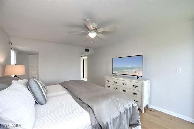 929 Collier Ct Unit B401, Marco Island, FL 34145 - bedroom with light wood-type flooring, baseboards, and ceiling fan