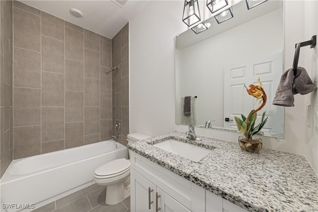 5205/5207 26th St SW, Lehigh Acres, FL 33973 - bathroom with toilet, bathtub / shower combination, vanity, and tile patterned floors