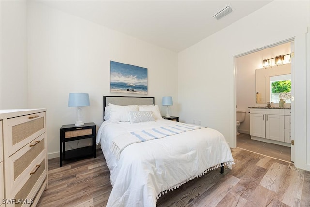 5205/5207 26th St SW, Lehigh Acres, FL 33973 - bedroom featuring light wood finished floors and ensuite bathroom