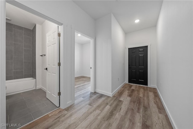 5205/5207 26th St SW, Lehigh Acres, FL 33973 - foyer with wood finished floors and baseboards