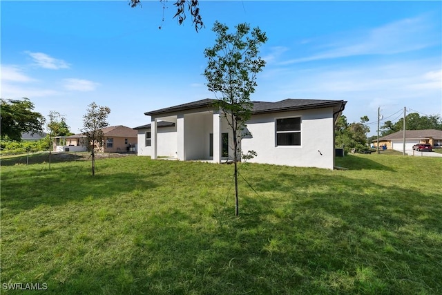5205/5207 26th St SW, Lehigh Acres, FL 33973 - back of property featuring stucco siding