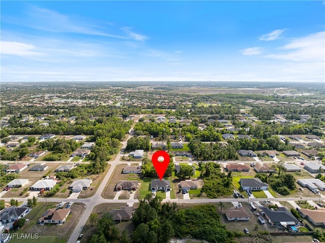5205/5207 26th St SW, Lehigh Acres, FL 33973 - aerial overview of property's location with nearby suburban area