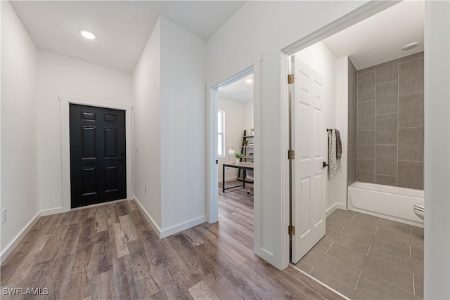 5205/5207 26th St SW, Lehigh Acres, FL 33973 - foyer entrance featuring wood finished floors and baseboards