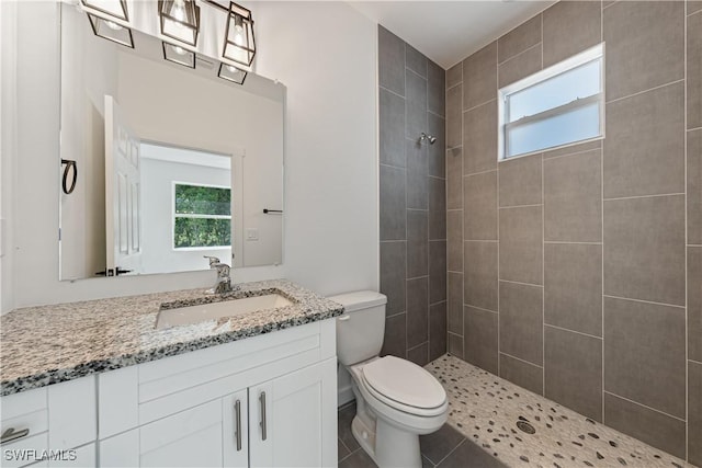 5205/5207 26th St SW, Lehigh Acres, FL 33973 - bathroom featuring tiled shower, toilet, and plenty of natural light