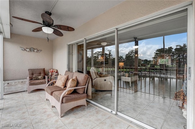 7065 Dennis Cir Unit F204, Naples, FL 34104 - sunroom with a ceiling fan and a water view