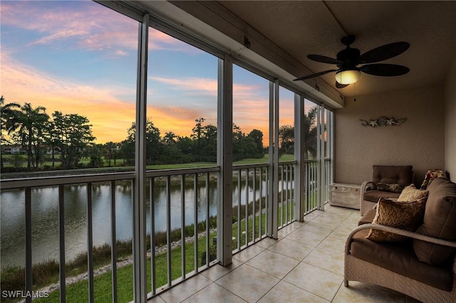 7065 Dennis Cir Unit F204, Naples, FL 34104 - sunroom / solarium featuring a water view