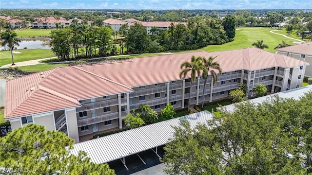 7065 Dennis Cir Unit F204, Naples, FL 34104 - aerial view of a golf course, a nearby body of water, and apartment complex