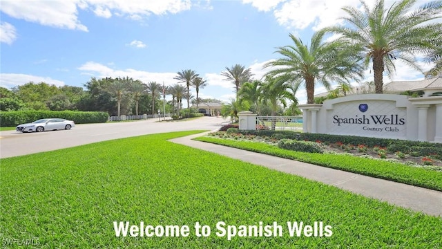 9851 Costa Mesa Ln Unit 308, Bonita Springs, FL 34135 - community sign with a yard