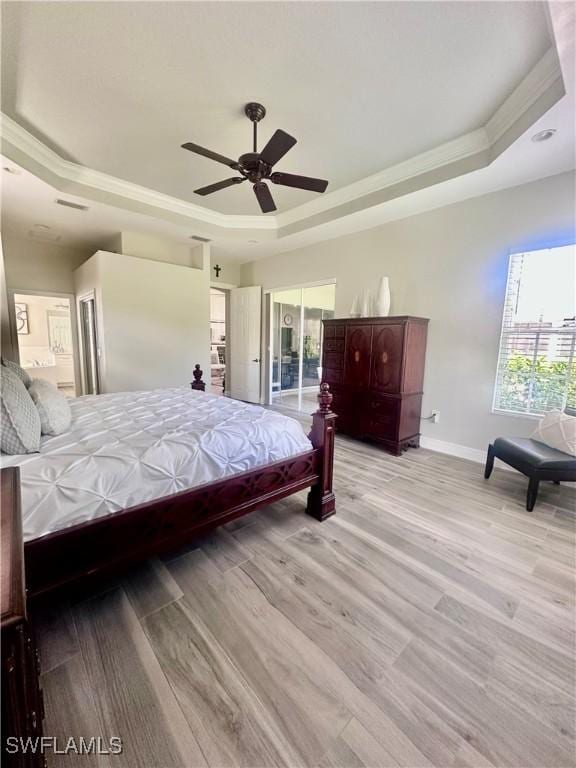5489 Whispering Willow Way, Fort Myers, FL 33908 - bedroom with a raised ceiling, baseboards, ornamental molding, light wood finished floors, and ceiling fan
