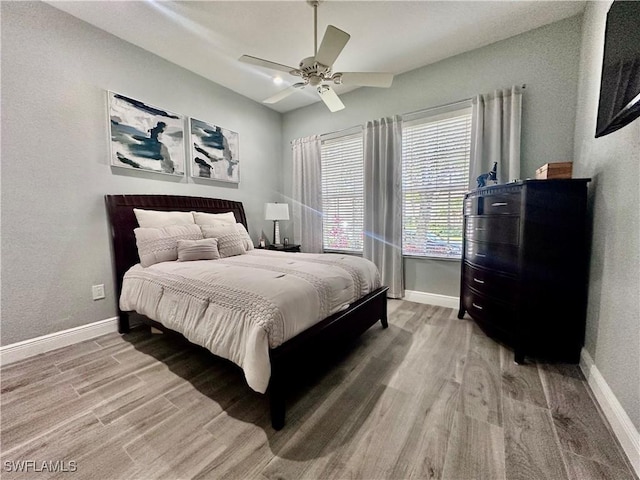 5489 Whispering Willow Way, Fort Myers, FL 33908 - bedroom with light wood-style floors, baseboards, and ceiling fan