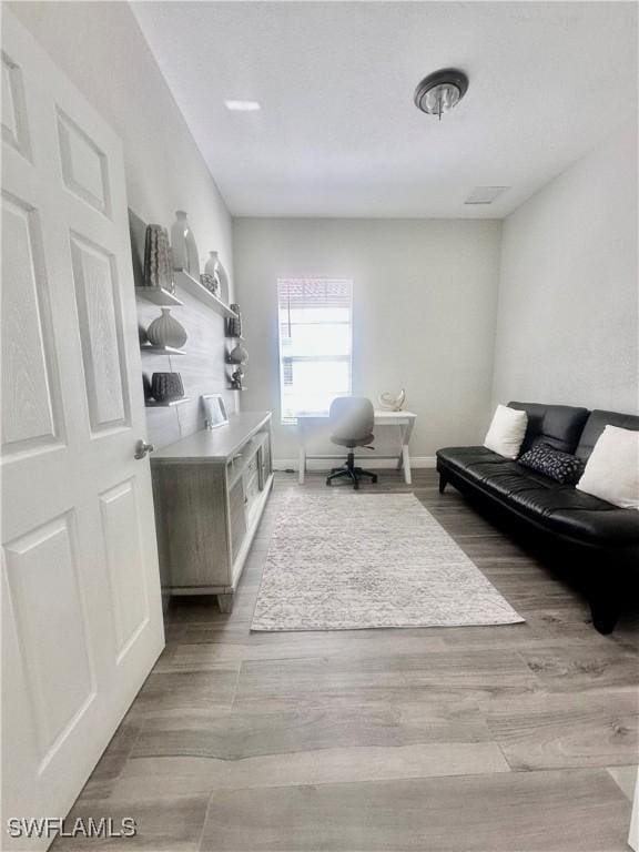 5489 Whispering Willow Way, Fort Myers, FL 33908 - office area featuring wood finished floors and baseboards