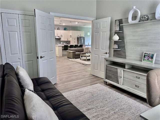 5489 Whispering Willow Way, Fort Myers, FL 33908 - living room featuring light wood finished floors