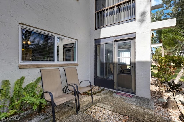 2100 Barkeley Ln Unit 1, Fort Myers, FL 33907 - property entrance featuring stucco siding and a patio area