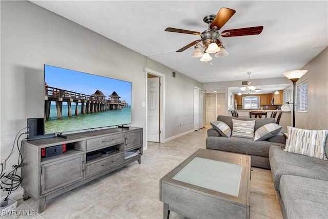 2100 Barkeley Ln Unit 1, Fort Myers, FL 33907 - living room with ceiling fan and a chandelier