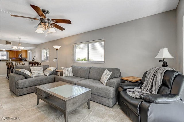 2100 Barkeley Ln Unit 1, Fort Myers, FL 33907 - living area with ceiling fan and light tile patterned floors