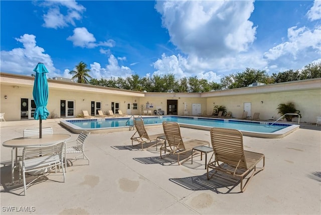 2100 Barkeley Ln Unit 1, Fort Myers, FL 33907 - community pool featuring a patio area
