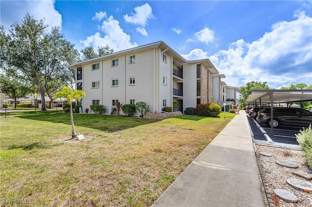 2100 Barkeley Ln Unit 1, Fort Myers, FL 33907 - view of property with covered parking