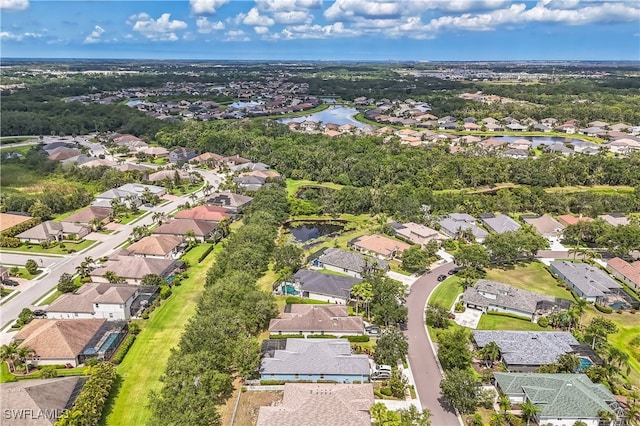 12642 Cara Cara Loop, Bradenton, FL 34212 - aerial view of property and surrounding area featuring nearby suburban area and a large body of water