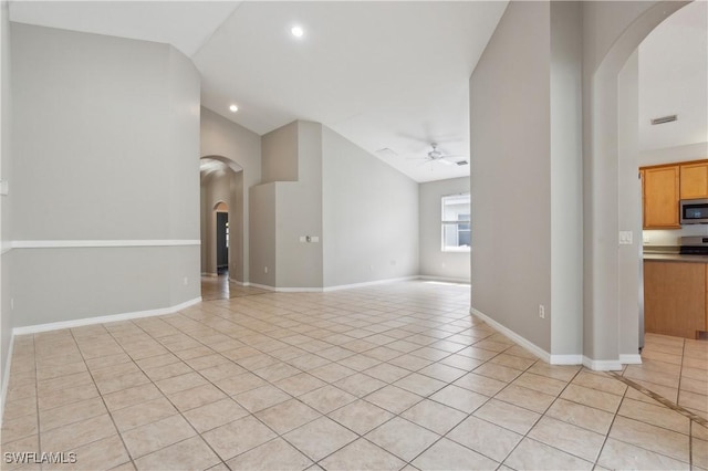 12642 Cara Cara Loop, Bradenton, FL 34212 - unfurnished living room featuring light tile patterned floors, ceiling fan, arched walkways, baseboards, and recessed lighting