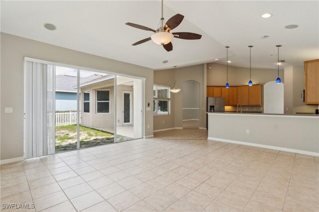 12642 Cara Cara Loop, Bradenton, FL 34212 - unfurnished living room with lofted ceiling, ceiling fan, a sink, light tile patterned floors, and recessed lighting