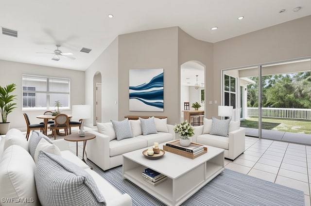 12642 Cara Cara Loop, Bradenton, FL 34212 - living room featuring arched walkways, ceiling fan, recessed lighting, light tile patterned floors, and vaulted ceiling