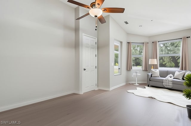 12642 Cara Cara Loop, Bradenton, FL 34212 - sitting room with ceiling fan, baseboards, wood finished floors, and high vaulted ceiling