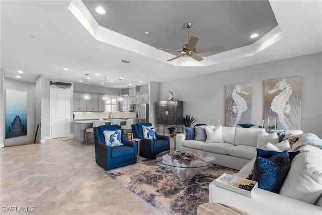 8761 Bellano Ct Unit 202, Naples, FL 34119 - living room featuring ceiling fan, recessed lighting, crown molding, and a tray ceiling