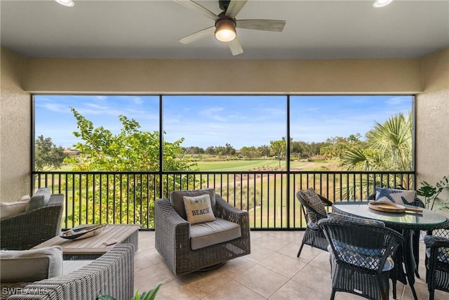 8761 Bellano Ct Unit 202, Naples, FL 34119 - sunroom featuring ceiling fan and view of golf course