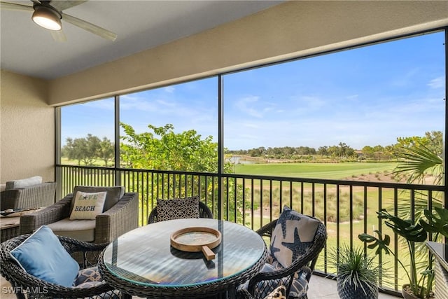 8761 Bellano Ct Unit 202, Naples, FL 34119 - sunroom with a ceiling fan and view of golf course
