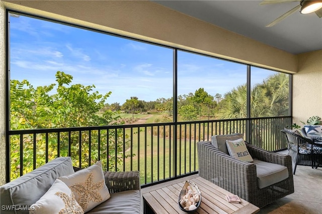 8761 Bellano Ct Unit 202, Naples, FL 34119 - sunroom / solarium featuring a ceiling fan and outdoor lounge area