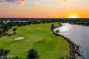 8761 Bellano Ct Unit 202, Naples, FL 34119 - drone / aerial view of a large body of water and a golf course