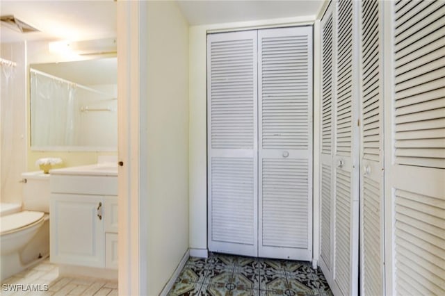 4900 Biscayne Dr Unit 14, Naples, FL 34112 - bathroom with a closet, toilet, vanity, and curtained shower