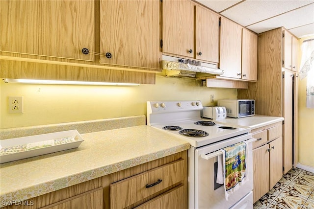 4900 Biscayne Dr Unit 14, Naples, FL 34112 - kitchen with white range with electric stovetop, under cabinet range hood, and light countertops