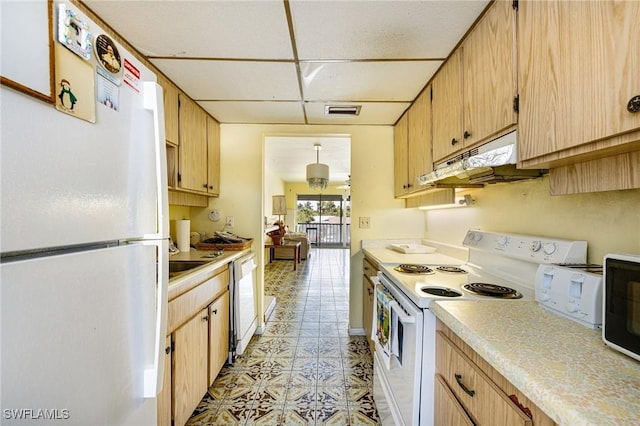 4900 Biscayne Dr Unit 14, Naples, FL 34112 - kitchen featuring white appliances, under cabinet range hood, and light countertops