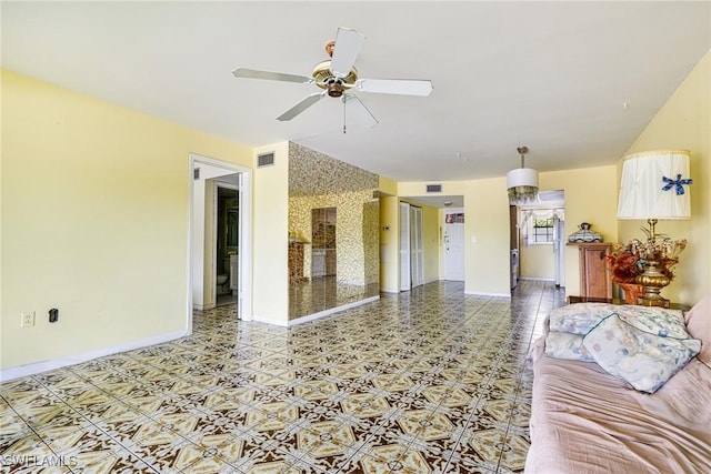 4900 Biscayne Dr Unit 14, Naples, FL 34112 - unfurnished living room featuring a ceiling fan and baseboards