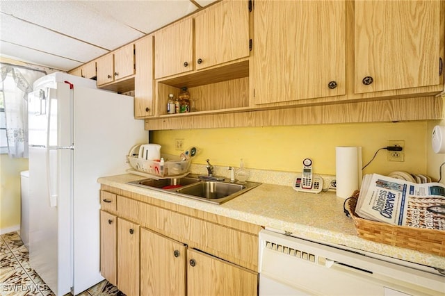 4900 Biscayne Dr Unit 14, Naples, FL 34112 - kitchen featuring dishwashing machine, a sink, light countertops, freestanding refrigerator, and light brown cabinets