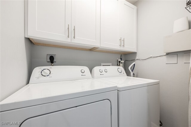 2797 1st St Unit 803, Fort Myers, FL 33916 - laundry area featuring washer and dryer and cabinet space