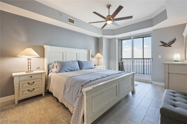 2797 1st St Unit 803, Fort Myers, FL 33916 - bedroom featuring access to exterior, baseboards, crown molding, ceiling fan, and light wood-style flooring