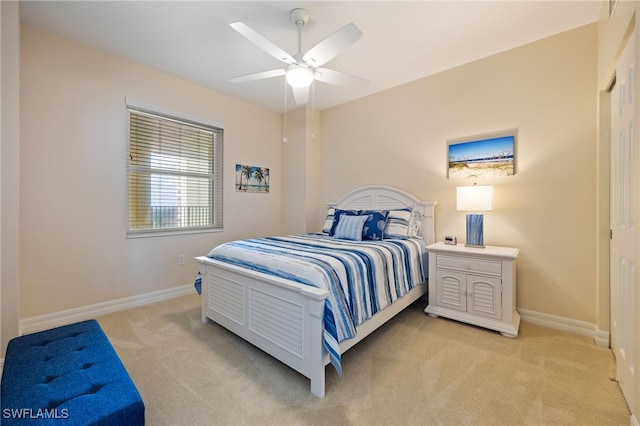 2797 1st St Unit 803, Fort Myers, FL 33916 - bedroom featuring light carpet, baseboards, and a ceiling fan