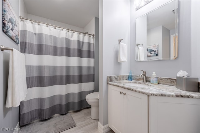 2797 1st St Unit 803, Fort Myers, FL 33916 - full bathroom with toilet, vanity, wood finished floors, and curtained shower