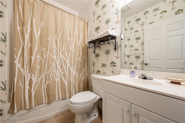 2797 1st St Unit 803, Fort Myers, FL 33916 - bathroom featuring wallpapered walls, vanity, toilet, tile patterned flooring, and shower / bathtub combination with curtain