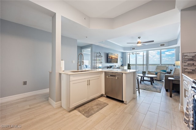 2797 1st St Unit 803, Fort Myers, FL 33916 - kitchen featuring open floor plan, a sink, dishwasher, and a raised ceiling