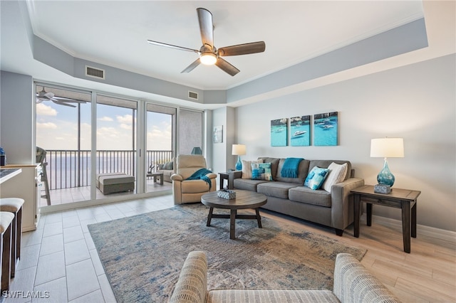 2797 1st St Unit 803, Fort Myers, FL 33916 - living area with ceiling fan, ornamental molding, and baseboards