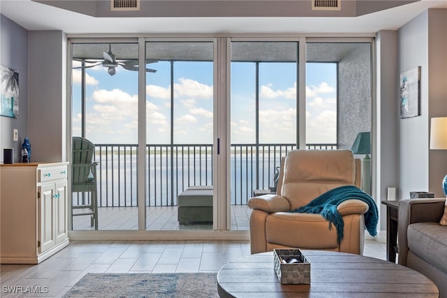 2797 1st St Unit 803, Fort Myers, FL 33916 - tiled living area featuring ceiling fan and healthy amount of natural light