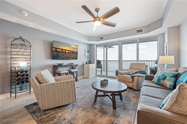 2797 1st St Unit 803, Fort Myers, FL 33916 - living room featuring a ceiling fan, wood finished floors, crown molding, and baseboards