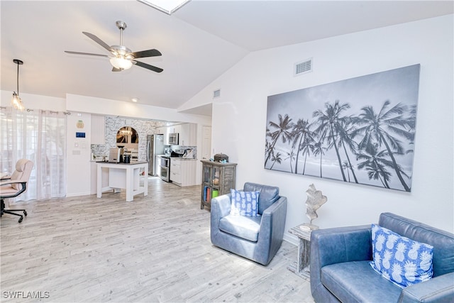 25379 Paladin Ln, Punta Gorda, FL 33983 - living area featuring lofted ceiling, light wood-style floors, ceiling fan, and a desk