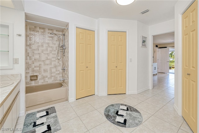 25379 Paladin Ln, Punta Gorda, FL 33983 - bathroom with a closet, washtub / shower combination, vanity, and tile patterned flooring